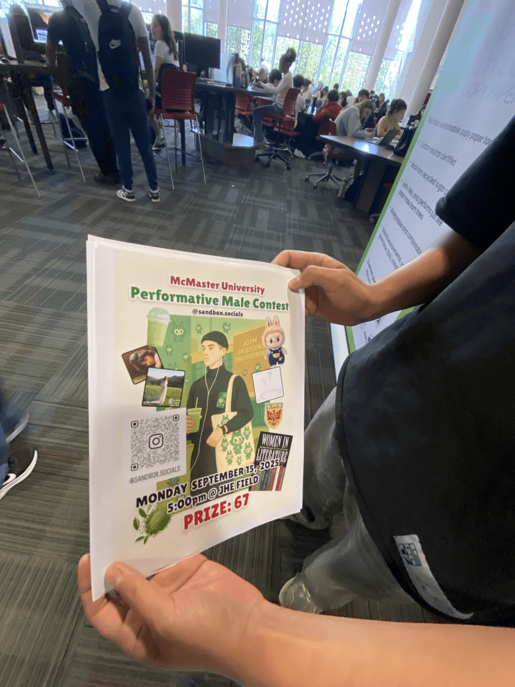 Someone holding printed performative male contest flyers